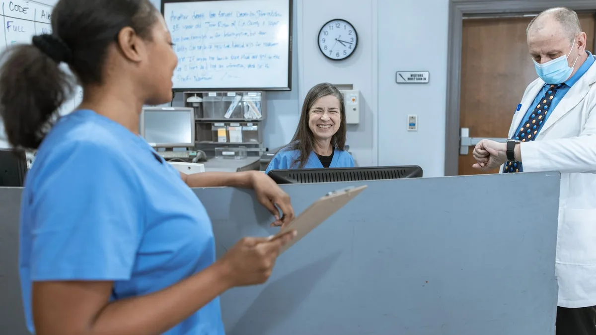 Doctors and nurses working together in a hospital, focused on patient care.
